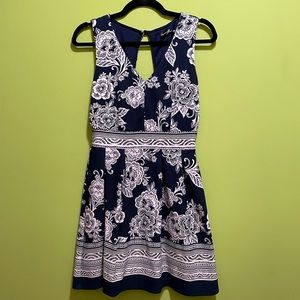 Blue dress with white floral pattern. Size s with open back. A line